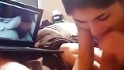 Teen brunette sucks her bf's cock while watching porn