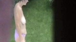 Big boobs brunette in topless outdoor recored by voyeur