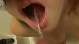 Masked redhead sucks cock and gets pissing in her mouth